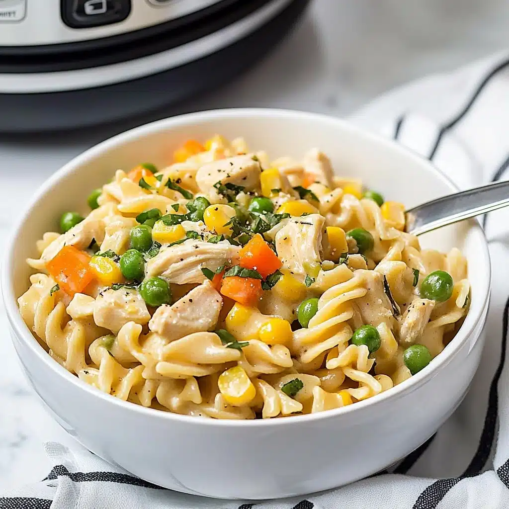 Instant Pot Cheesy Chicken, Noodles and Vegetables, Cheesy Chicken and Noodles, Easy Instant Pot Chicken Dinner, Comfort Food Recipes A white bowl filled with creamy pasta made of three layers: the bottom layer is soft egg noodles with a pale yellow color; the middle layer has chunks of light brown cooked chicken pieces mixed with bright green beans, orange carrot cubes, yellow corn, and green peas; the top layer is sprinkled with fresh chopped dark green parsley that adds a fresh touch. The pasta looks coated with a smooth creamy sauce and is placed on a white marbled surface with a striped black and white cloth beside it. A silver fork is resting inside the bowl, and the photo was taken with an iphone