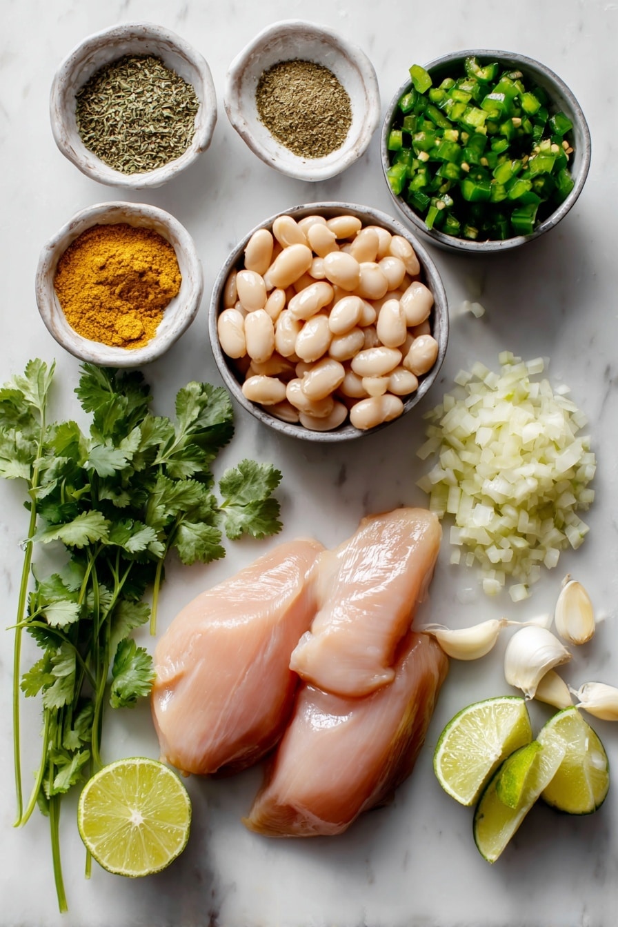 Flat lay of boneless skinless chicken breasts, cans of white beans with some beans spilled out, diced green chiles in a small heap, minced garlic cloves, finely diced yellow onion, fresh cilantro sprigs, fresh lime wedges cut in halves and quarters, and ground cumin and dried oregano sprinkled in small piles, all beautifully arranged on a white marble surface, photo taken with an iphone --ar 2:3 --v 7 - Crockpot White Chicken Chili, white chicken chili, slow cooker chicken chili, easy chicken chili, healthy white chili