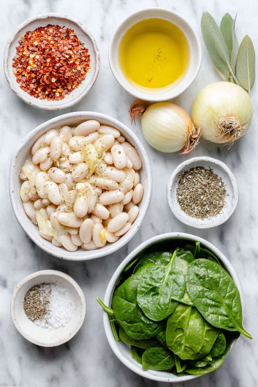Flat lay of a small white ceramic bowl of extra virgin olive oil, a small peeled onion, two medium shallots with papery skins, four whole garlic cloves, two sliced carrots cut into coins, two diced celery stalks, a large white ceramic bowl of drained white cannellini beans, two fresh green bay leaves, a small white bowl of dried Italian seasoning herbs, a small white bowl of red pepper flakes, a large white ceramic bowl of fresh vibrant green spinach leaves, a small white bowl of coarse sea salt, and a small white bowl of ground black pepper all arranged symmetrically placed on a clean white marble surface, soft natural light, photo taken with an iPhone, professional food photography style, fresh ingredients, white ceramic bowls, no bottles, no duplicates, no utensils, no packaging --ar 2:3 --v 7 --p awthu7i m7354615311229779997 - Creamy Tuscan White Bean Soup, easy Tuscan bean soup, hearty white bean soup, vegan Tuscan soup, healthy white bean recipes