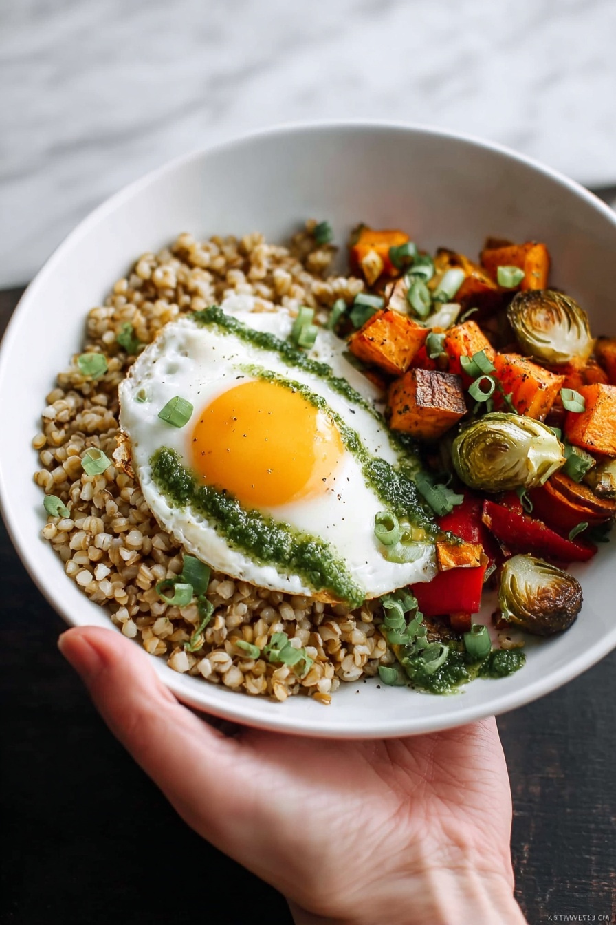 A white bowl is filled with three main layers: on the left, a bed of cooked brown grains with a slightly moist texture, topped with small green herb pieces; next to it, a colorful mix of roasted vegetables including red bell peppers, Brussels sprouts halved and light green inside, orange sweet potato cubes, and chunks of red onion; on top of the vegetables rests a fried egg with a bright yellow runny yolk spilling onto the vegetables and grains, with green herb sauce drizzled on the egg white. A fork is pulling into the yolk from the bottom left of the bowl, held by a woman's hand. The bowl sits on a white marbled textured cloth background with a bit of wooden surface showing. Photo taken with an iphone --ar 2:3 --v 7 - Roasted Vegetable Farro Bowl with Egg, healthy roasted vegetable bowl, hearty vegetarian dinner, easy quick weeknight meal, nutritious grain bowl