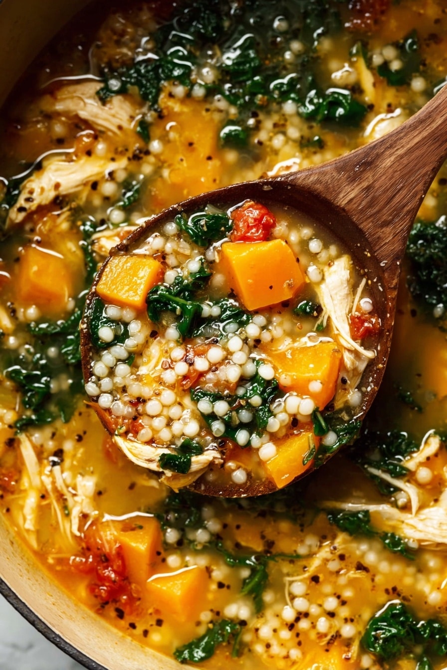 A wooden spoon lifts a thick soup filled with three main layers: plump white pearl-like grains scattered throughout, soft bright orange chunks of cooked squash, and wilted dark green leafy vegetables mixed in a light golden broth. The soup also contains pieces of shredded pale yellow chicken and small red tomato chunks, with black and white mustard seeds floating on top, all inside a pot sitting on a white marbled surface. The texture looks rich and hearty with a mix of soft and tender ingredients. Photo taken with an iphone --ar 2:3 --v 7 - Fall Chicken Stew with Quinoa and Butternut Squash, hearty fall chicken stew, healthy chicken and quinoa dinner, cozy autumn chicken stew, nutritious butternut squash stew