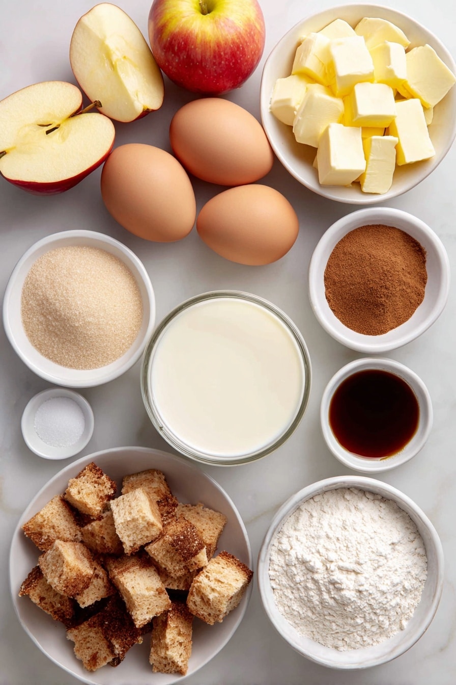 Flat lay of peeled, cored, and sliced fresh apples arranged neatly, diced rustic French bread cubes, six whole large eggs with clean shells, a small white ceramic bowl of whole milk, a small white ceramic bowl of heavy cream, a small white ceramic bowl filled with granulated sugar, a small white ceramic bowl with light brown sugar, a small white ceramic bowl containing all-purpose flour, a small white ceramic bowl holding ground cinnamon, a small white ceramic bowl with ground nutmeg, diced salted butter cubes arranged artfully on a simple white ceramic plate, and a small white ceramic bowl of clear vanilla extract placed symmetrically, all on a clean white marble surface, soft natural light, photo taken with an iPhone, professional food photography style, fresh ingredients, white ceramic bowls, no bottles, no duplicates, no utensils, no packaging --ar 2:3 --v 7 --p awthu7i m7354615311229779997 - Apple French Toast Casserole, baked apple breakfast, cinnamon apple brunch, easy apple casserole, cozy breakfast recipes