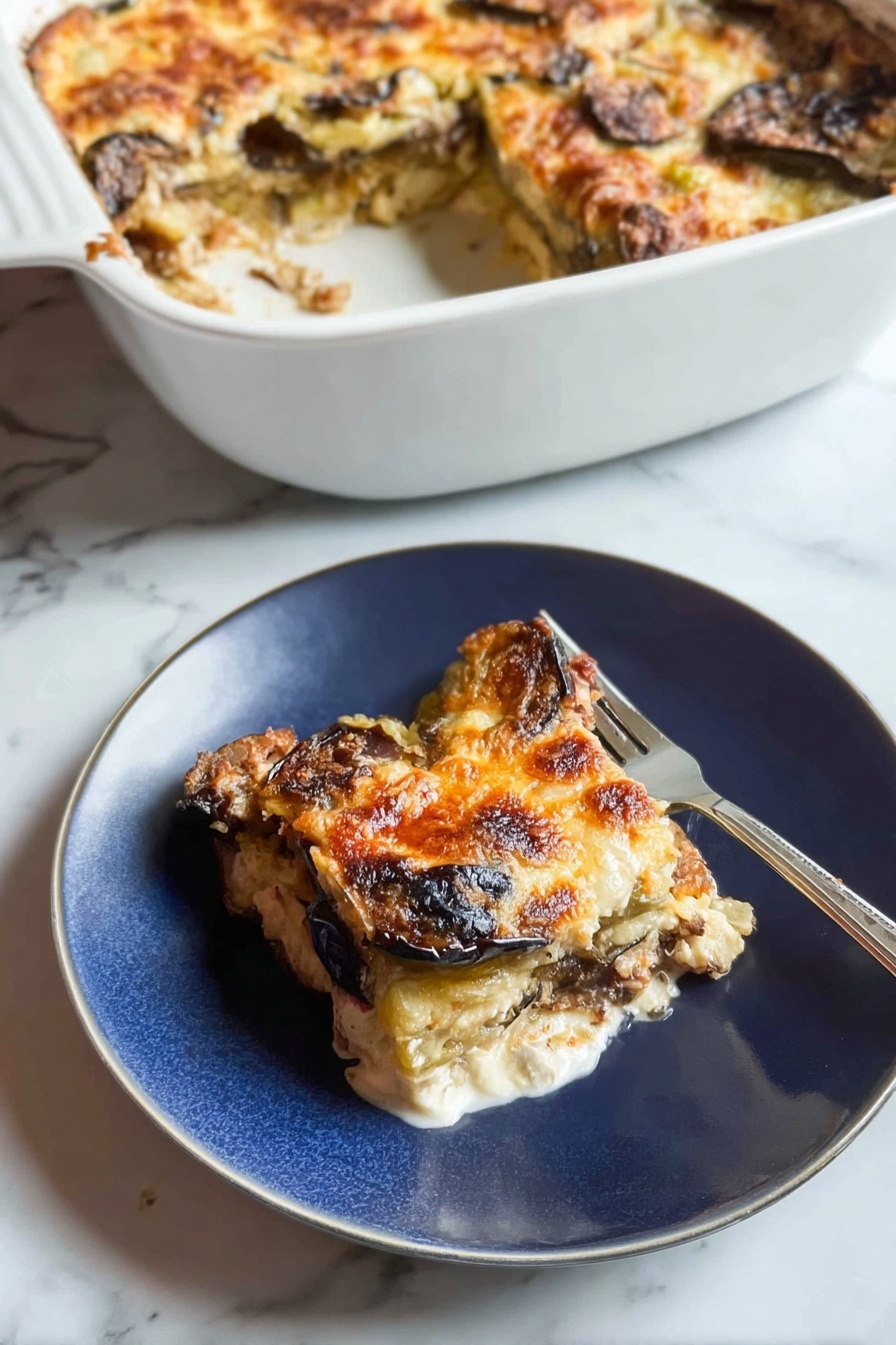 A white casserole dish sits in the background, filled with a baked layered dish that has a golden, slightly browned cheese crust with some darker browned spots, showing eggplant or similar vegetables beneath. In the foreground, a piece of this dish is served on a white plate, showing three visible layers: the top layer is melted golden cheese with some browned spots, the middle layer has slices of dark brown roasted eggplant, and the bottom layer is a white creamy base, possibly cheese or sauce. A fork rests on the plate next to the food. The background surface is a white marbled texture. Photo taken with an iphone --ar 2:3 --v 7 - Healthy Chicken Zucchini Bake, healthy chicken casserole, zucchini chicken bake, nutritious baked chicken dish, easy healthy dinner