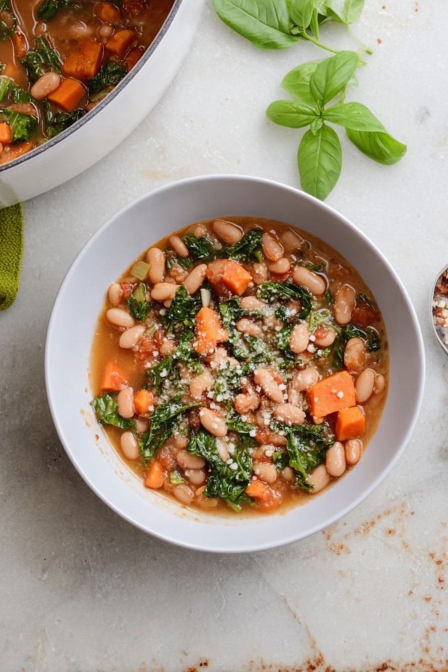 A white bowl filled with a stew made of light brown beans, bright orange carrot pieces, and green leafy vegetables in a light brown broth. Small white grains sprinkled on top add texture. To the top left, part of a white pot with the same stew is visible. Fresh green basil leaves lie beside the bowl on a white marbled surface with some scattered leaves and crumbs around it. photo taken with an iphone --ar 2:3 --v 7 - Cranberry Bean Soup, hearty bean soup recipe, easy winter soup, vegan bean soup, nutritious dinner ideas