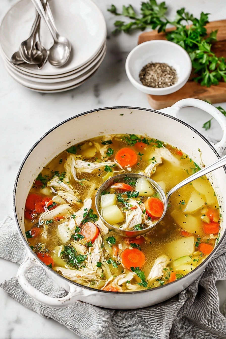 A big white pot filled with light brown clear broth with many ingredients floating in it, including shredded white chicken pieces, round orange carrot slices, small white potato chunks, and small green celery pieces. Fresh green parsley leaves are sprinkled on top, and some black pepper is visible in the broth. A silver ladle is resting inside the pot, partly submerged in the soup, revealing a close-up of the vegetable and chicken mix. The pot sits on a grey cloth on a white marbled surface with a small white bowl of black pepper in the upper left corner. Photo taken with an iphone --ar 2:3 --v 7 - Ultimate Chicken Soup, comforting chicken soup, healthy chicken soup, hearty chicken vegetable soup, easy homemade chicken soup