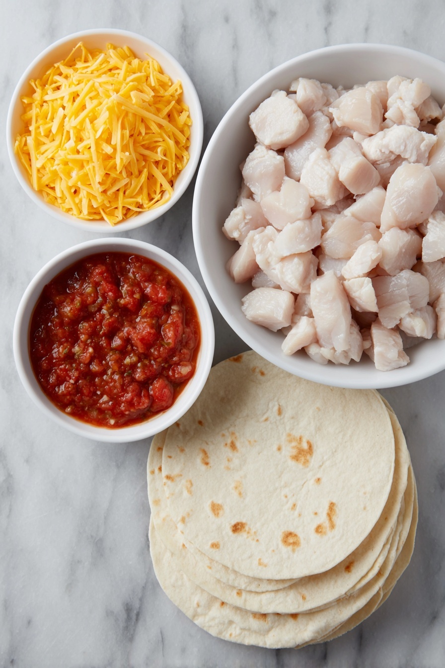Flat lay of diced cooked chicken in a simple white ceramic bowl, a small white bowl filled with vibrant red salsa, a small white bowl holding bright orange shredded sharp cheddar cheese, a stack of fresh, soft flour tortillas slightly fanned out, placed on a clean white marble surface, soft natural light, photo taken with an iPhone, professional food photography style, fresh ingredients, white ceramic bowls, no bottles, no duplicates, no utensils, no packaging --ar 2:3 --v 7 --p m7354615311229779997 - Easy Chicken Quesadilla Casserole, Chicken Quesadilla Casserole, cheesy chicken casserole, quick chicken dinner,  easy weeknight casserole