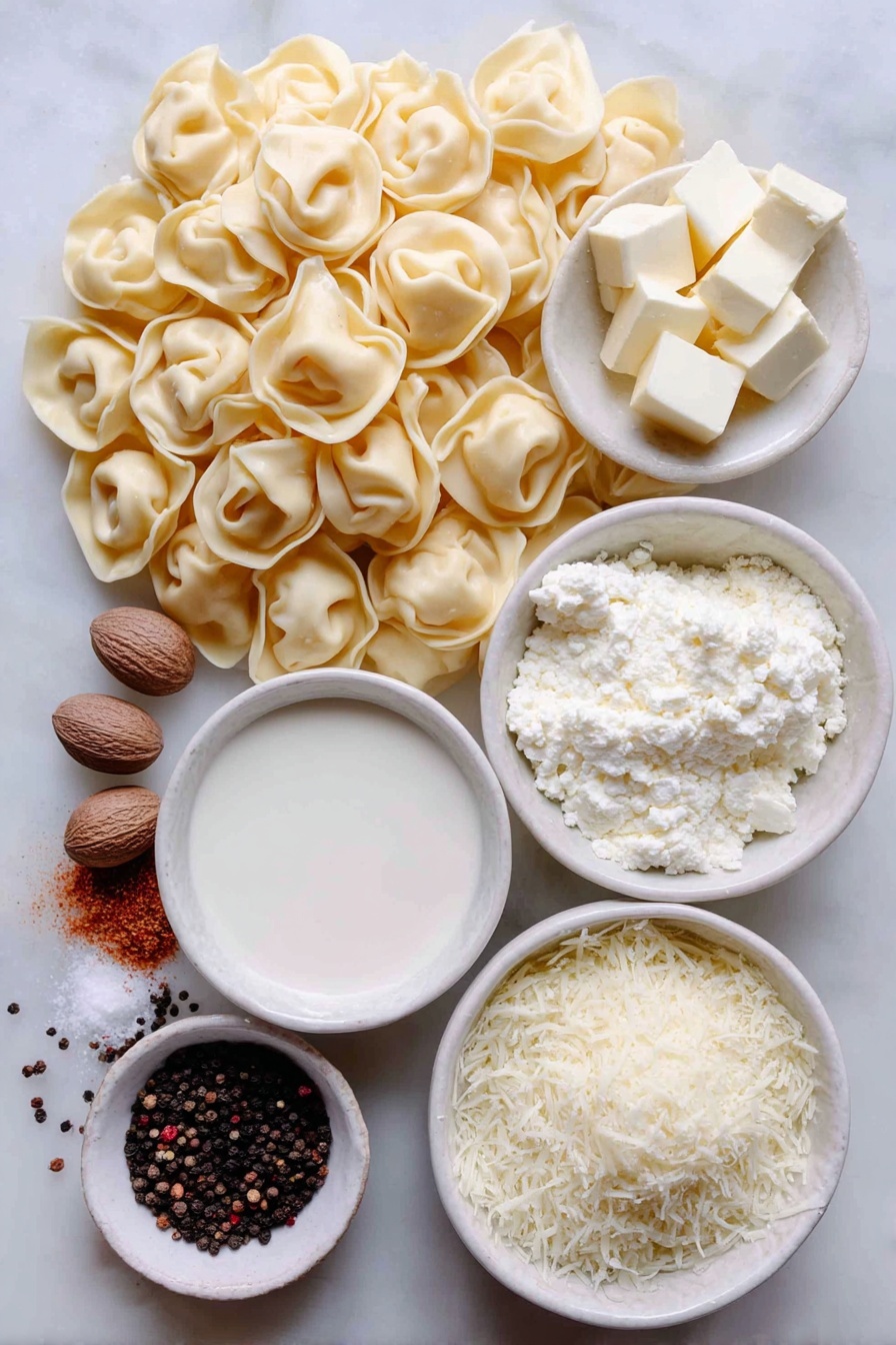 Flat lay of a mound of fresh cheese tortellini pasta, a small white ceramic bowl of unsalted butter cubes, a small white ceramic bowl filled with heavy cream, a small white ceramic bowl of freshly grated parmesan cheese, a few whole nutmeg seeds next to a small pile of ground nutmeg, a small cluster of whole black peppercorns with some freshly ground black pepper scattered nearby, all arranged symmetrically and balanced, placed on a clean white marble surface, soft natural light, photo taken with an iPhone, professional food photography style, fresh ingredients, white ceramic bowls, no bottles, no duplicates, no utensils, no packaging --ar 2:3 --v 7 --p m7354615311229779997 - Creamy Cheese Tortellini, cheese tortellini recipe, easy creamy pasta, quick comfort food, cheesy pasta dish