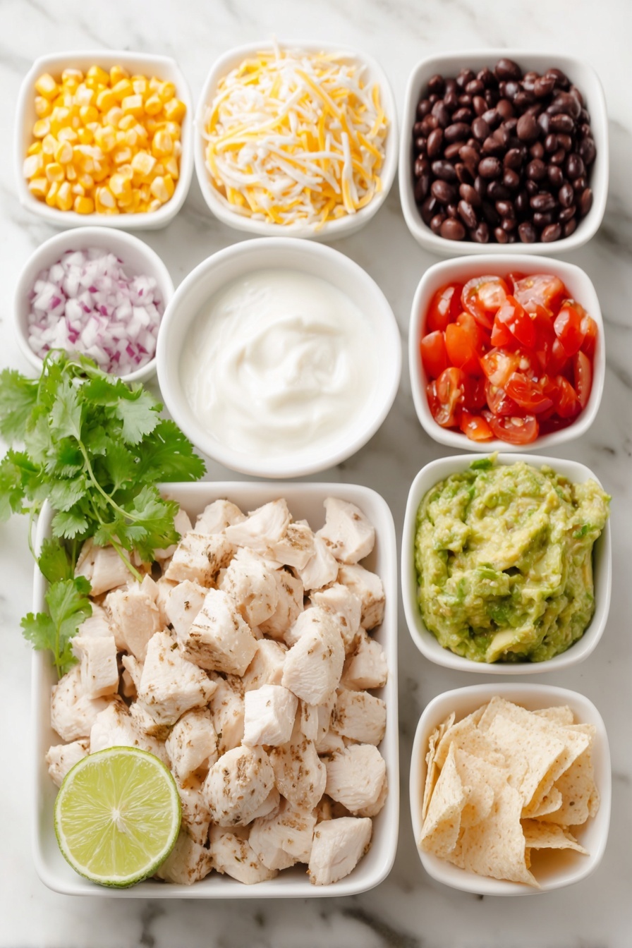 Flat lay of cubed cooked chicken breast, a small bowl of black beans, a small bowl of corn kernels, a small bowl of diced tomatoes, a small bowl of diced red onion, a small bowl of shredded cheddar cheese, a few sprigs of fresh cilantro, a small bowl of plain Greek yogurt, a small bowl of low sugar BBQ sauce, a halved lime with visible juice, diced avocado pieces, and a small pile of crushed tortillas, all arranged symmetrically in simple white ceramic bowls and plates, placed on a clean white marble surface, soft natural light, photo taken with an iPhone, professional food photography style, fresh ingredients, white ceramic bowls, no bottles, no duplicates, no utensils, no packaging --ar 2:3 --v 7 --p m7354615311229779997 - Southwest Chicken Salad with Black Beans, Southwest Chicken Salad, Black Bean Chicken Salad, Healthy Southwest Chicken Salad, Easy Southwest Salad