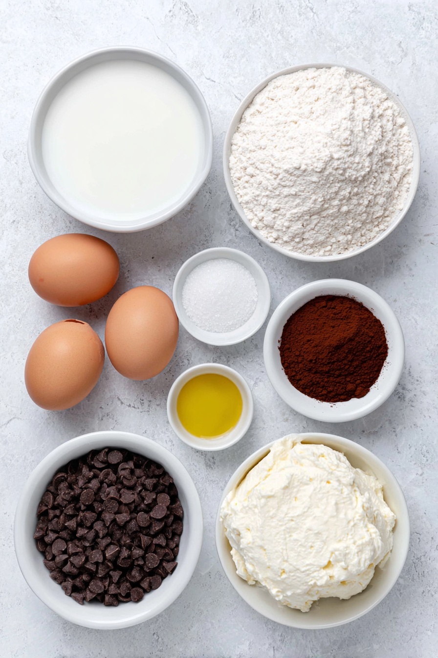 Flat lay of a small white ceramic bowl of whole milk, a small white ceramic bowl with white vinegar, a small white ceramic bowl with golden vegetable oil, a small white ceramic bowl of all-purpose flour, a small white ceramic bowl of deep reddish-brown cocoa powder, a small white ceramic bowl of light brown sugar, two whole uncracked brown eggs with clean shells, a small white ceramic bowl of white baking powder, a small white ceramic bowl of fine white salt, a small white ceramic bowl of creamy white cream cheese, a small white ceramic bowl of fine white icing sugar, a small white ceramic bowl of mini dark chocolate chips placed symmetrically on a clean white marble surface, soft natural light, photo taken with an iPhone, professional food photography style, fresh ingredients, white ceramic bowls, no bottles, no duplicates, no utensils, no packaging --ar 2:3 --v 7 --p m7354615311229779997 - Red Velvet Mug Cake, Red Velvet Mug Cake recipe, easy mug cake, quick desserts, single-serving cake
