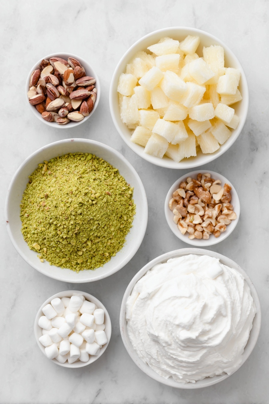 Flat lay of a small mound of bright green pistachio pudding powder, a simple white ceramic bowl filled with crushed pineapple chunks with juice, a small white bowl overflowing with white miniature marshmallows, scattered light brown chopped nuts, and a neat dollop of fluffy white whipped topping arranged on a simple white ceramic plate, all placed on a clean white marble surface, soft natural light, photo taken with an iPhone, professional food photography style, fresh ingredients, white ceramic bowls, no bottles, no duplicates, no utensils, no packaging --ar 2:3 --v 7 --p m7354615311229779997 - Watergate Salad, Easy Watergate Salad, No-Bake Fruit Dessert, Fast Potluck Dessert, Creamy Fruit Salad