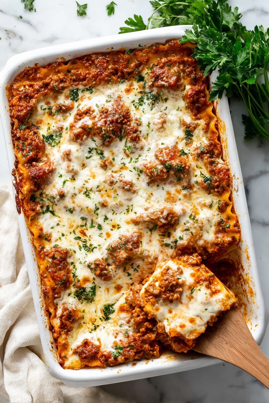 A close-up view of a lasagna dish inside a white baking dish, showing multiple layers of pasta, meat sauce, and melted white cheese on top. The top cheese layer is smooth and creamy with hints of browned spots and small green herb pieces sprinkled across. The meat sauce looks rich and chunky with a reddish-brown color mixed with bits of orange from melted cheese inside. A wooden spoon is lifting a portion, revealing several pasta sheets coated in sauce and melted cheese, with the woman's hand holding the spoon partly visible on the right side. The dish sits on a white marbled surface. photo taken with an iphone --ar 2:3 --v 7 - Cheesy Baked Ravioli with Meat Sauce, baked ravioli recipe, cheesy ravioli casserole, easy baked ravioli, hearty pasta bake