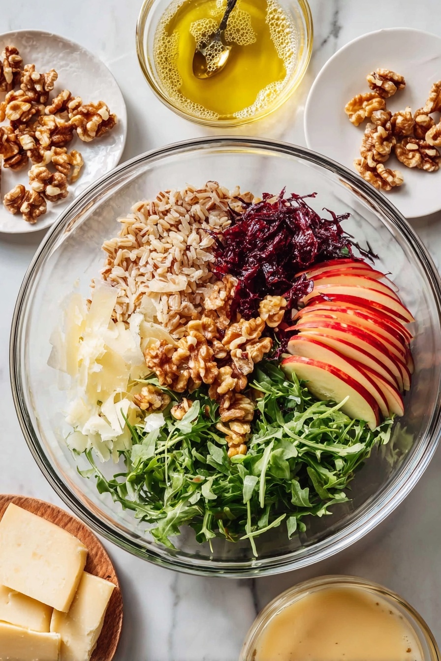 A clear glass bowl with six distinct layers: thin red apple slices with skin on at the bottom right, fresh green arugula leaves on the far right, dark red shredded cabbage below the apple slices, light shaved cheese slices at the bottom left, golden brown walnut pieces piled in the center, chopped dark reddish-brown dates with a slightly shiny texture above the walnuts, and a pile of light brown cooked grains filling the top center. Around the bowl on a white marbled surface are three small round white plates holding more walnut pieces, thin cheese slices, and a creamy beige sauce in a glass bowl with a spoon. Nearby is another glass bowl containing a light yellow oil with bubbles. Photo taken with an iphone --ar 2:3 --v 7 - Nutty Farro Salad with Apples and Arugula, healthy farro salad, apple and arugula salad recipe, nutritious grain salad, easy wholesome salads