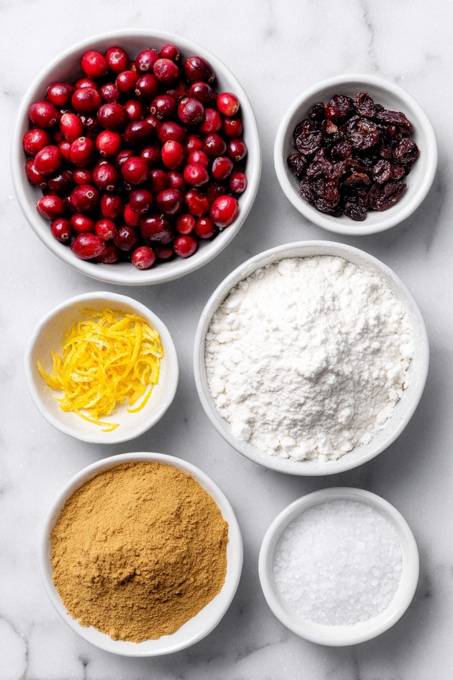 Flat lay of a small mound of fresh bright red cranberries, a small white ceramic bowl filled with fine white granulated sugar, a few strips of fresh orange zest curled gently, a small white bowl of deep golden ground cinnamon powder, a small white bowl of warm brown ground ginger powder, a small white bowl of fine white cornstarch powder, a small white bowl with freshly squeezed orange juice showing a vibrant orange color, a small white bowl containing coarse kosher salt crystals placed symmetrically—all items arranged with perfect balance and fresh natural appearance, placed on a clean white marble surface, soft natural light, photo taken with an iPhone, professional food photography style, fresh ingredients, white ceramic bowls, no bottles, no duplicates, no utensils, no packaging --ar 2:3 --v 7 --p m7354615311229779997 - Easy Cranberry Pie with Orange and Spices, Cranberry Pie, Holiday Cranberry Pie, Simple Cranberry Pie Recipe, Festive Cranberry Dessert
