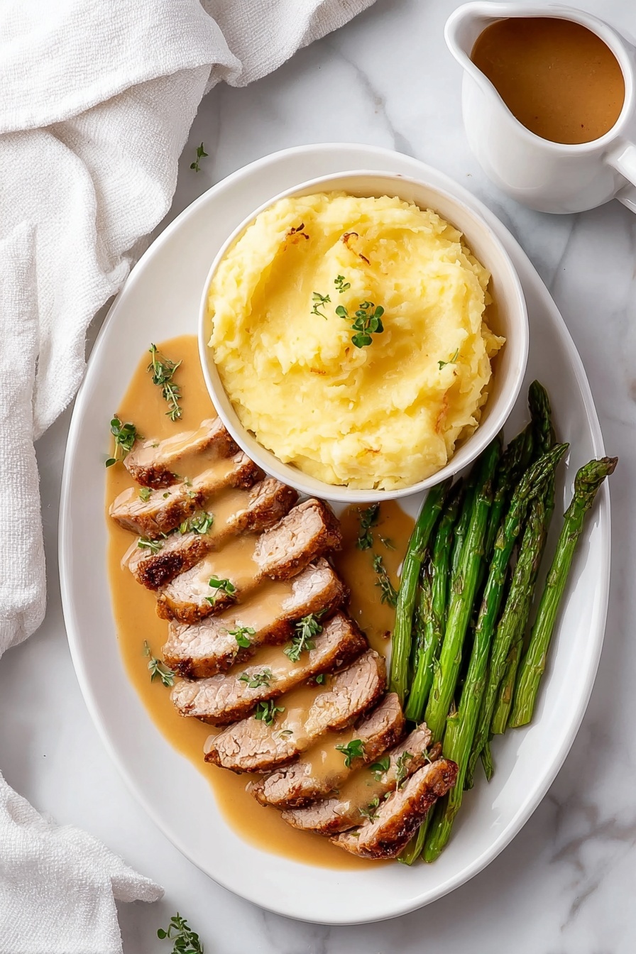 The image shows a white oval plate with three layers of food arranged neatly. On the top right, there is a white bowl filled with smooth, light yellow mashed potatoes, sitting on the plate. Below the bowl, two rows of sliced, cooked meat lay side by side, coated with a light brown sauce and garnished with small green herb leaves. On the bottom right corner of the plate, a bunch of green asparagus spears is placed parallel to the meat. The plate rests on a white marbled surface, and a white cloth is partially visible on the left side. There is also a small pitcher with brown sauce near the top right corner. Photo taken with an iphone --ar 2:3 --v 7 - Easy Garlic Turkey Tenderloin with Gravy, garlic turkey tenderloin, tender turkey recipes, quick turkey dinners, flavorful turkey main dish