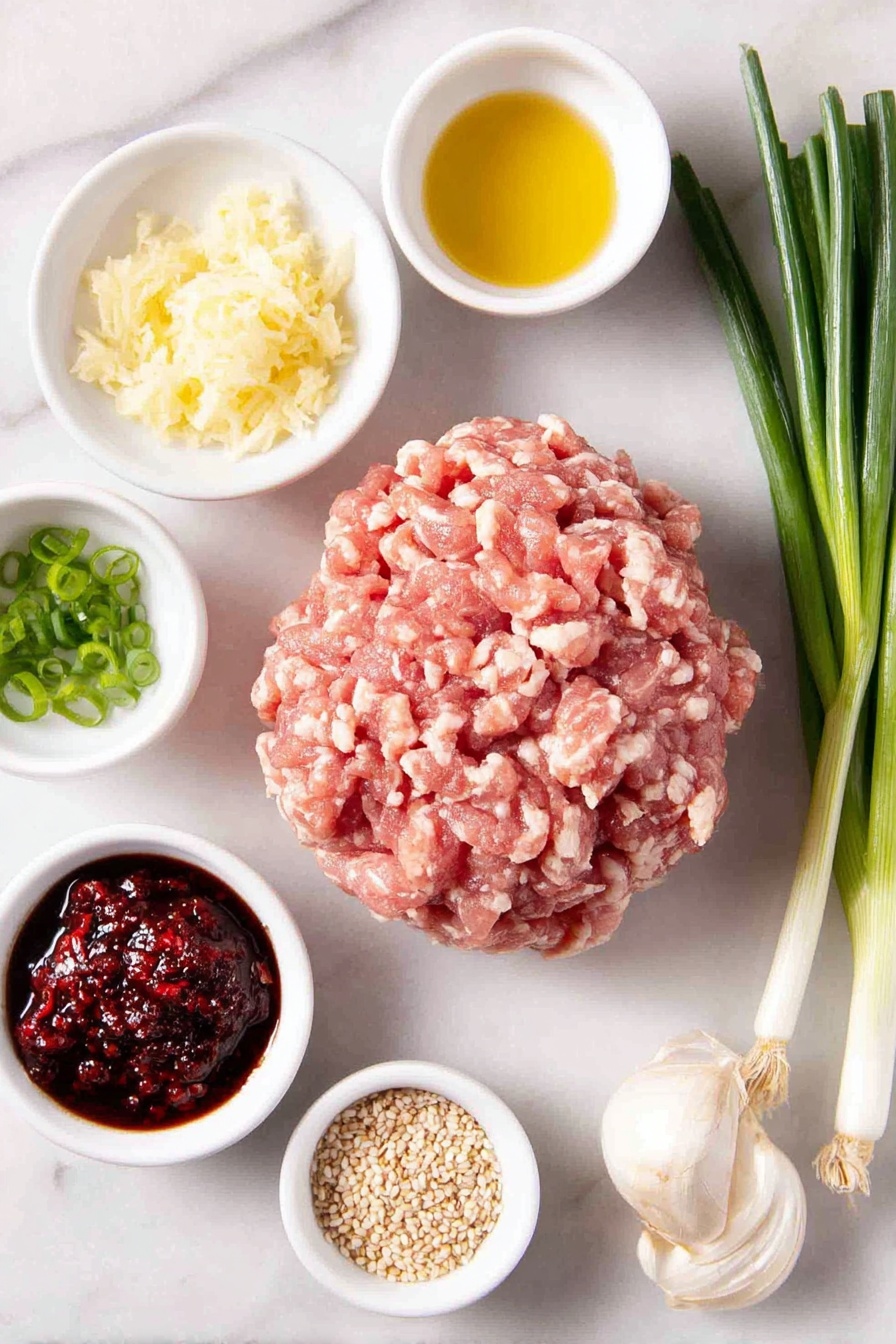 Flat lay of a mound of fresh ground chicken showing light and dark meat, a small bunch of whole scallions with green and white parts, a small white bowl with freshly grated ginger and juice, a small white bowl with grated garlic cloves, two small white bowls each containing gluten-free tamari sauce, a small white bowl with golden avocado oil, a few thinly sliced scallions arranged neatly, a small white bowl with rich red chili sambal, a small white bowl with toasted sesame seeds, all balanced symmetrically and placed on a clean white marble surface, soft natural light, photo taken with an iPhone, professional food photography style, fresh ingredients, white ceramic bowls, no bottles, no duplicates, no utensils, no packaging --ar 2:3 --v 7 --p m7354615311229779997 - Asian Chicken Meatballs, Asian Chicken Meatballs Recipe, Healthy Chicken Meatballs, Quick Asian Dinner, Easy Asian Meatballs