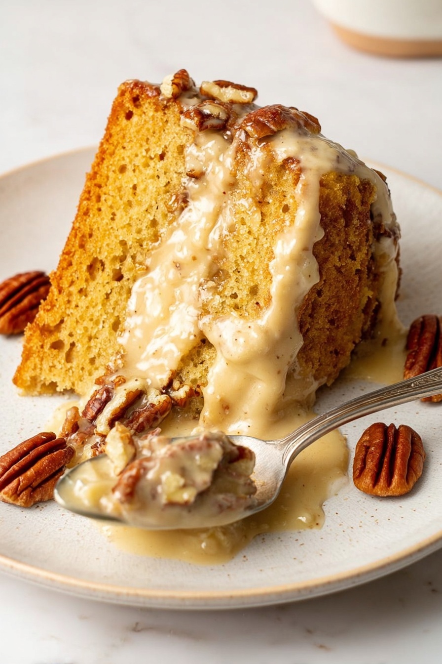 A slice of moist, golden-brown cake sits on a white plate with visible texture and small air pockets on the top layer. The middle layer is creamy and light beige, oozing slightly onto the plate. Scattered around the cake and on the spoon are several glossy, brown pecans. The spoon holds a portion of the creamy middle layer mixed with some pecan pieces. The plate rests on a white marbled surface. photo taken with an iphone --ar 2:3 --v 7 - Sweet Potato Pound Cake, Sweet Potato Pound Cake with Brown Butter Glaze, Moist Sweet Potato Cake, Fall Dessert Recipes, Easy Pound Cake Recipes