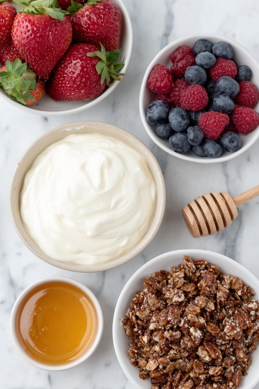 Flat lay of a small white ceramic bowl filled with thick plain Greek yogurt, a small white bowl with golden honey, a handful of mixed fresh berries including strawberries, blueberries, and raspberries scattered neatly, and a small white bowl containing crunchy homemade granola with visible oats and nuts, all arranged symmetrically placed on a clean white marble surface, soft natural light, photo taken with an iPhone, professional food photography style, fresh ingredients, white ceramic bowls, no bottles, no duplicates, no utensils, no packaging --ar 2:3 --v 7 --p m7354615311229779997 - Greek Yogurt Parfait with Berries and Granola, healthy breakfast parfait, easy fruit yogurt snack, quick nutritious breakfast, layered yogurt with berries